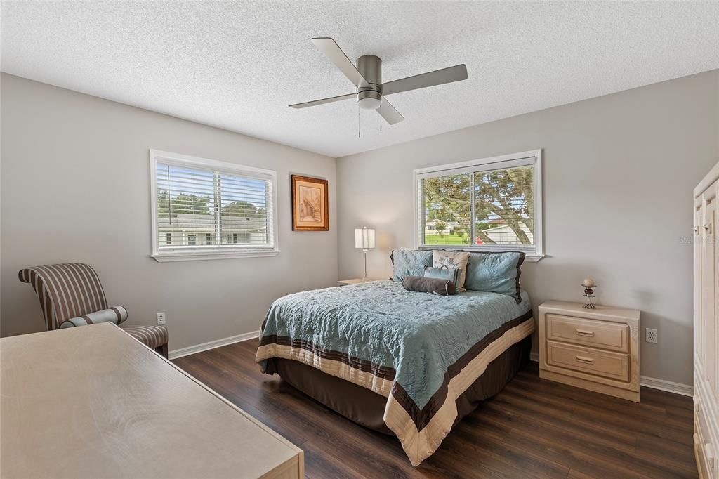 Guest bedroom with laminate flooring, LED lighting