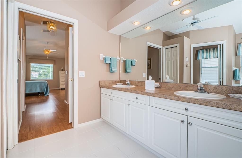 Primary Suite bath with a pocket door for privacy