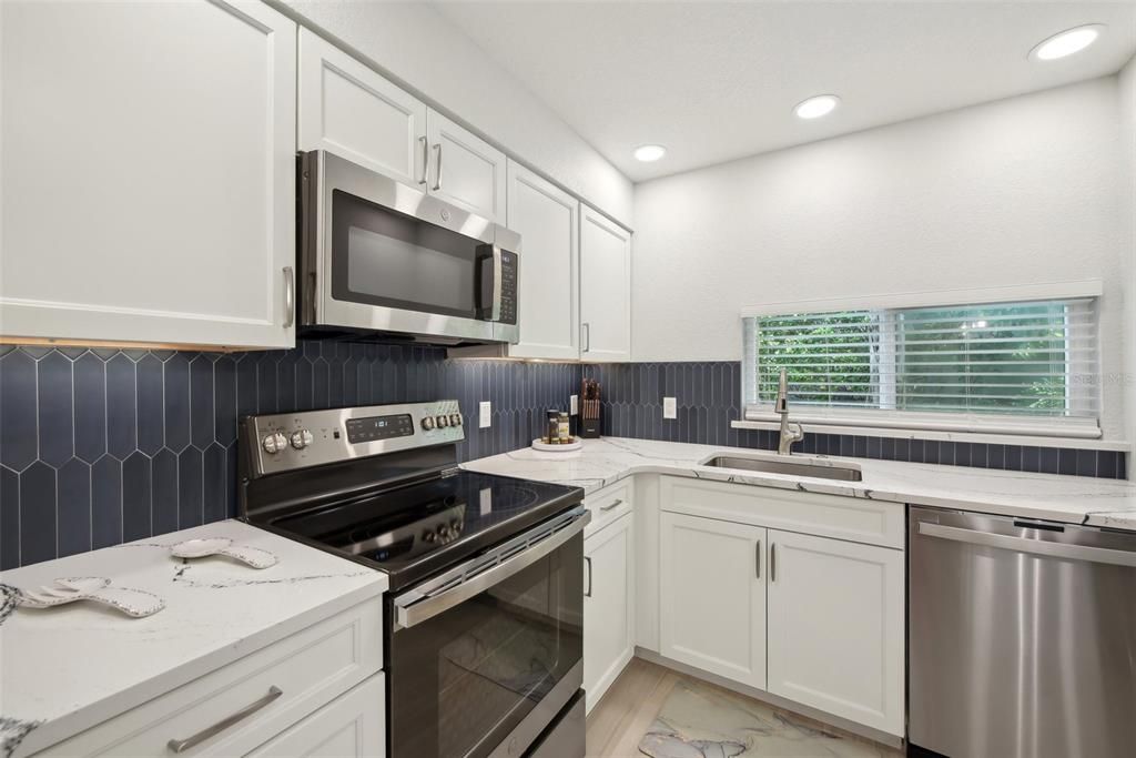 beautiful Quartz counters and custom backsplash