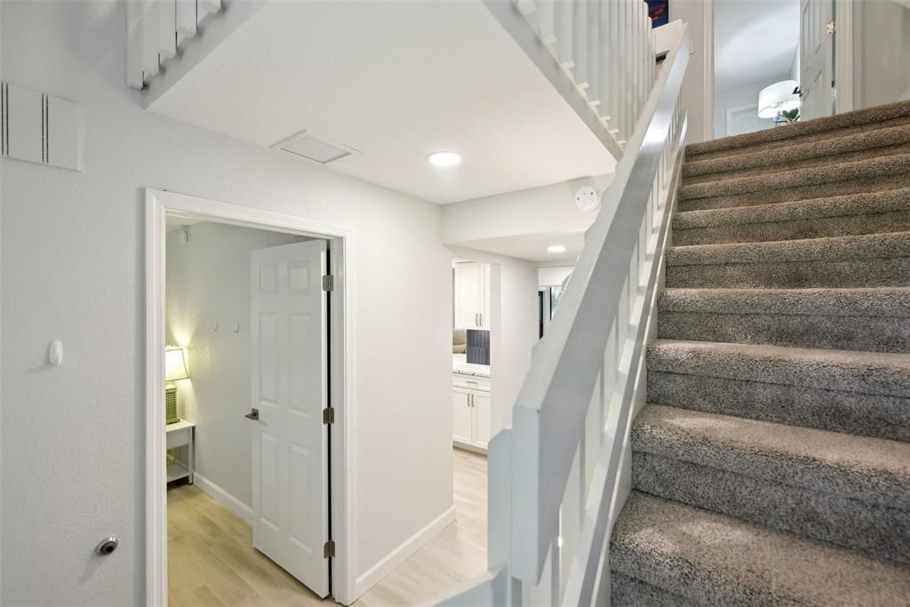 view into the first floor bedroom from the staircase landing