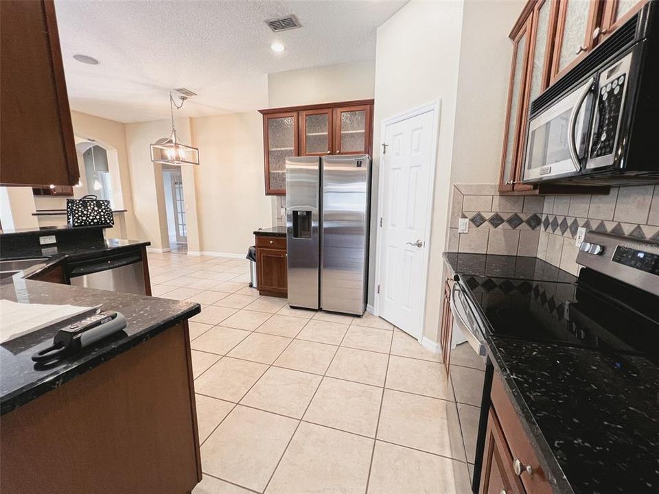 Beautiful kitchen open to dinette and family room.