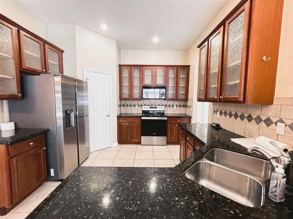 Kitchen features appliances and storage.