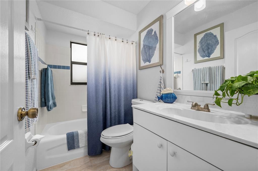 Second Bathroom with tub/shower combo. Tiled shower.