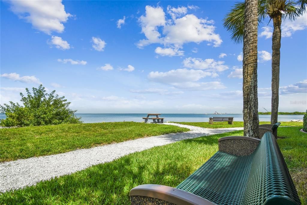 walking path all the way around the property with picnic tables and benches