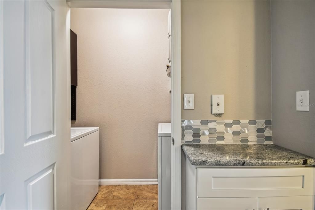 laundry room separate from kitchen (door separates)