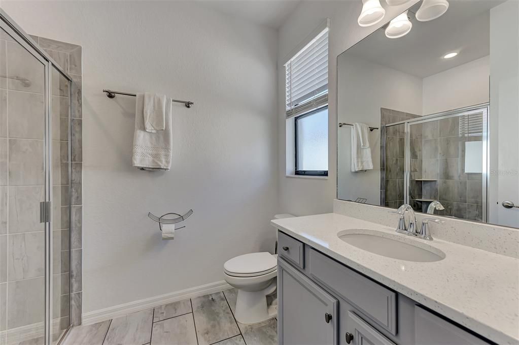 En-suite bathroom with walk-in shower.