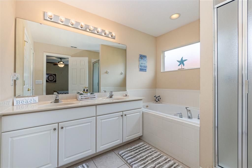 Master bathroom with dual sinks, garden tub and walk in shower