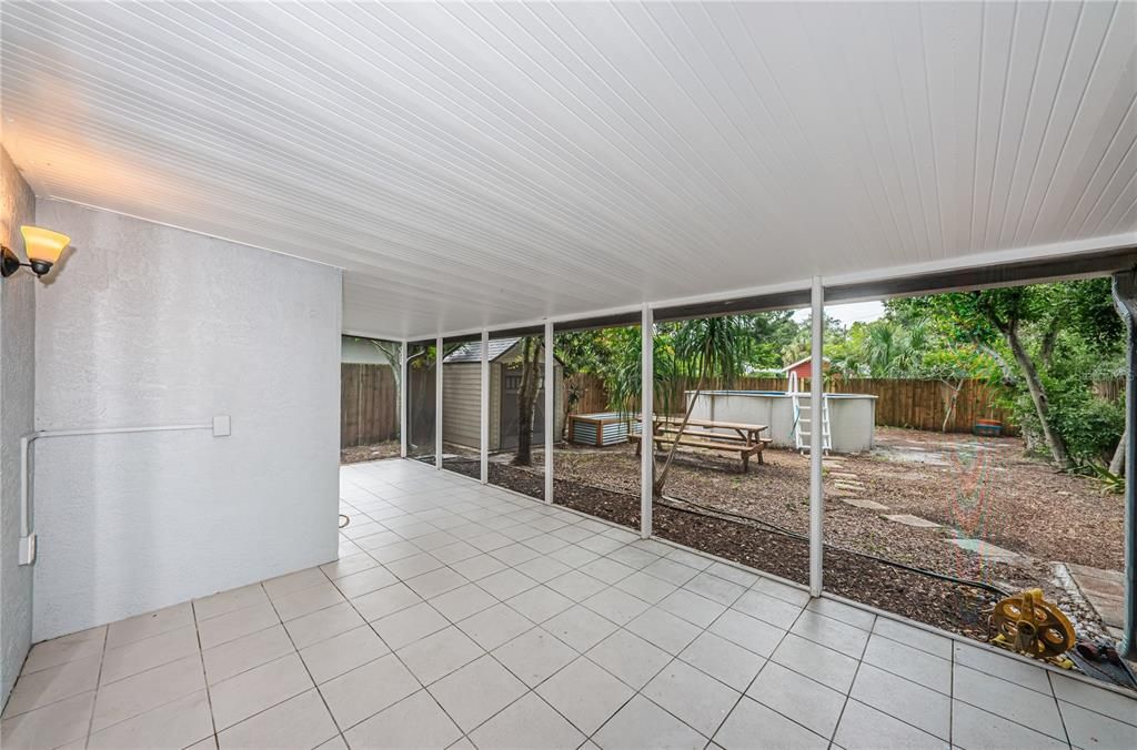 A view of the screened patio and back yard