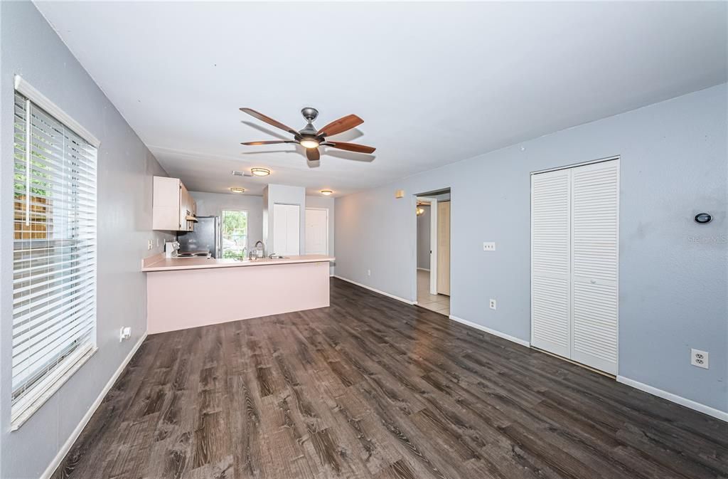 Alternate view of kitchen, front entry and hall to second bedroom and bath with view to side yard