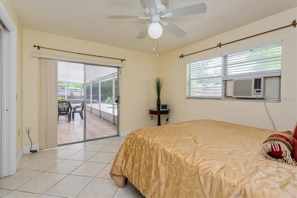 Bedroom3 with sliding glass doors to porch and pool