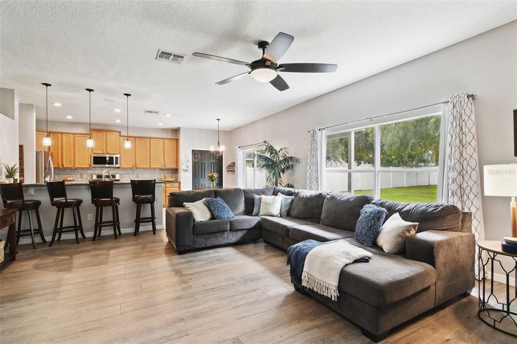 Bright Family Room with views of huge Back Yard and Kitchen.