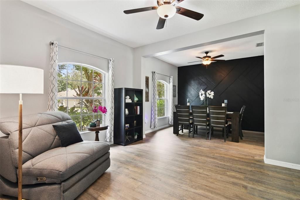 Living Room looking toward the Formal Dining Room. Beautiful luxury vinyl floors for easy care.