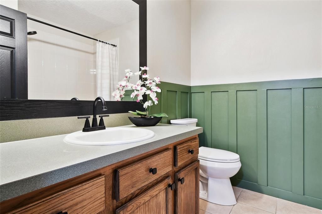 Upstairs Bathroom with combined Tub and Shower.