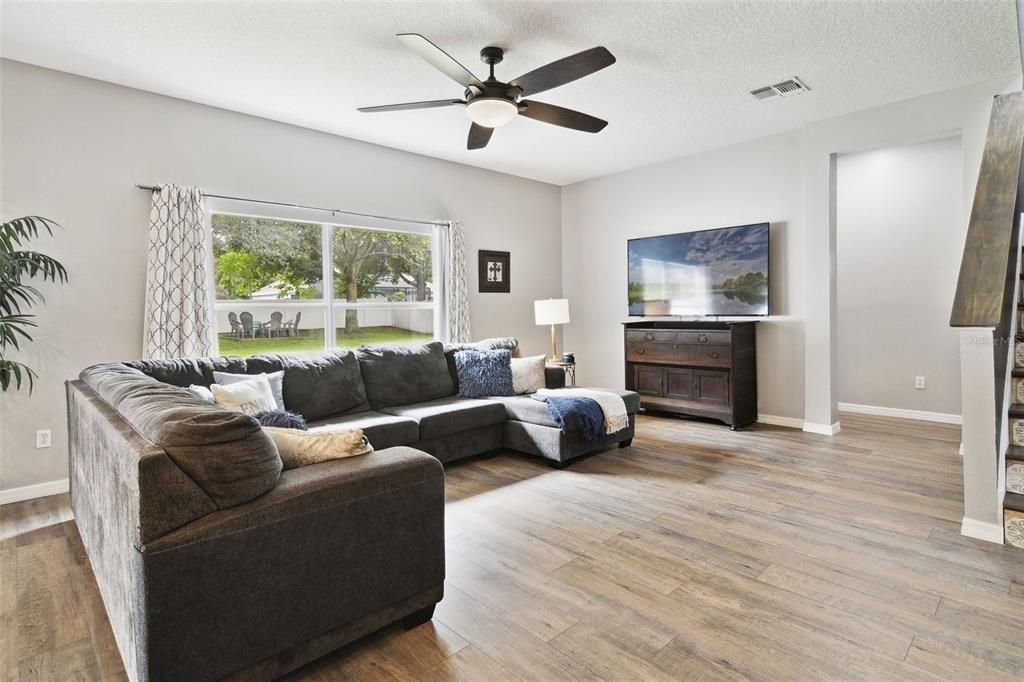 Large Family Room with view from Kitchen. Looking toward entry for downstairs Bedroom and full Bathroom,