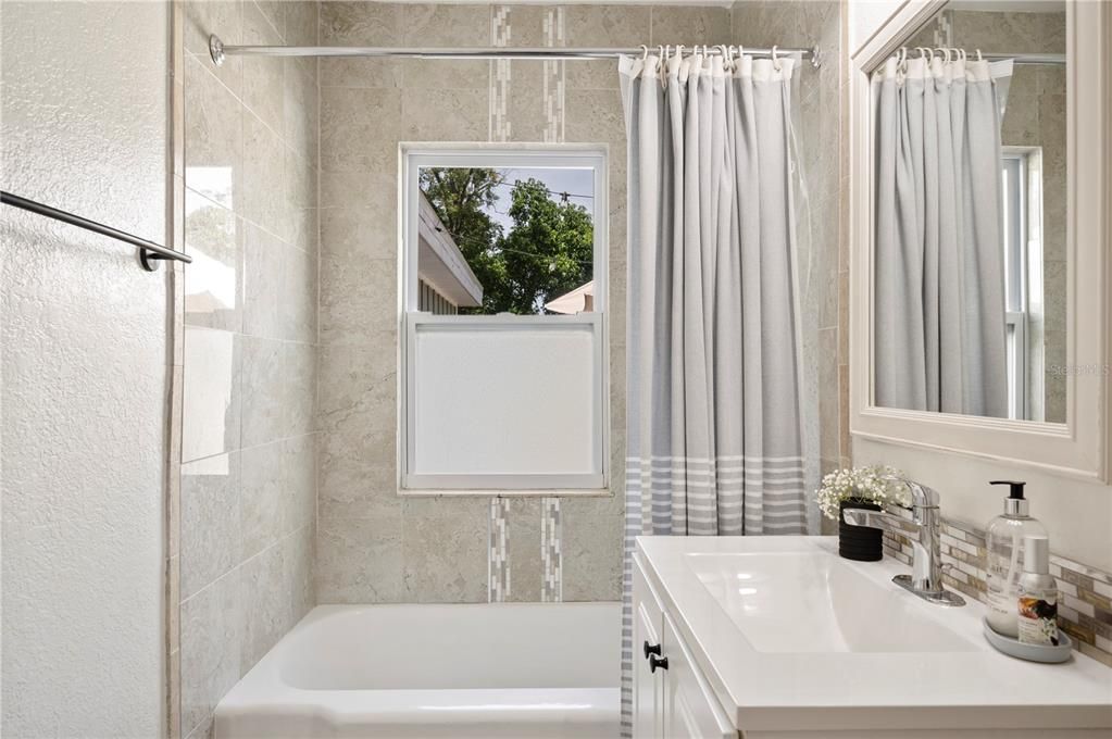 Second full bathroom with tub-shower