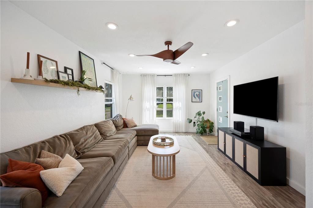 Living room with front door entrance