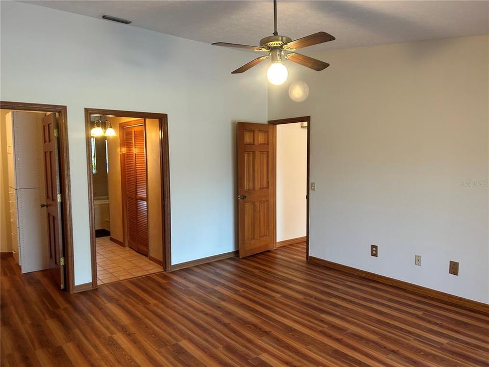 Primary bedroom with sliders to the pool