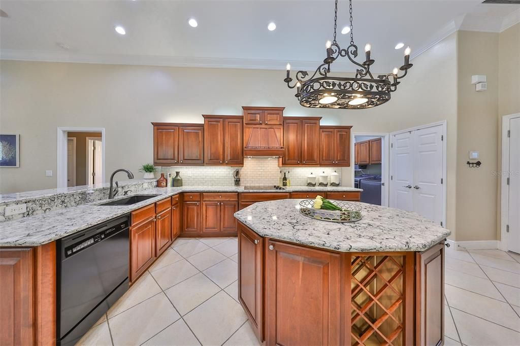 Kitchen with pantry. Wine rack in island. (Laundry room off to the right.)