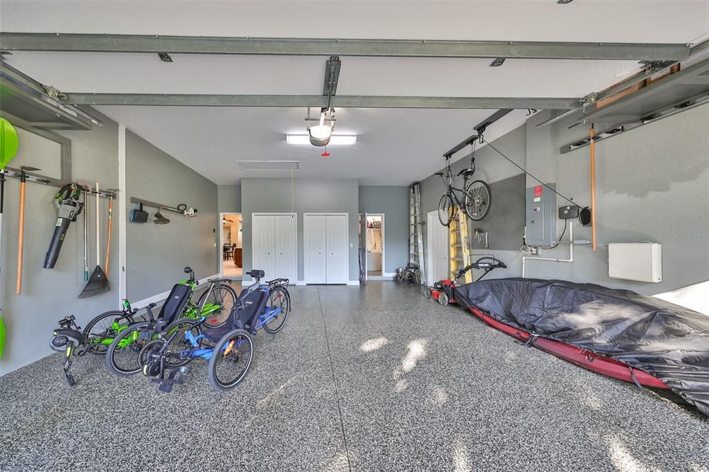 Impeccably clean, oversized 2-car garage with tool room and closet storage. Epoxy flooring.