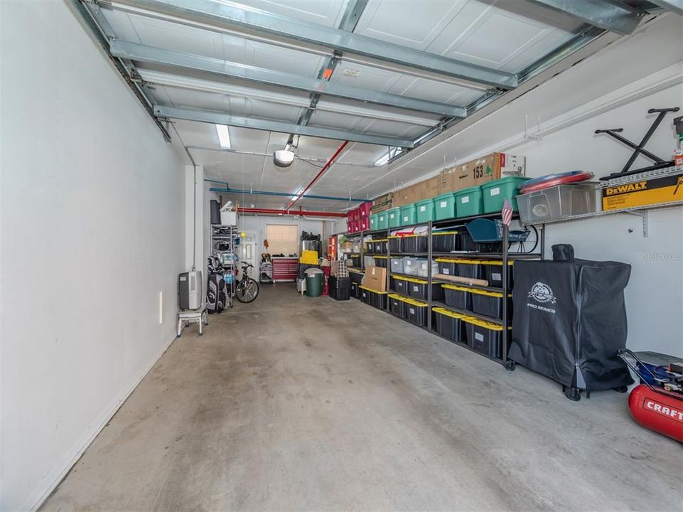 Tandem garage can fit two cars! Plenty of storage here!