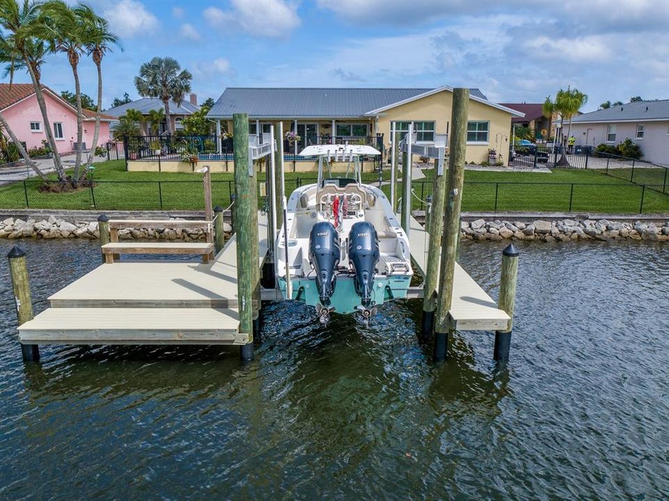 13,000 pound boat lift with a composite dock that has electric and water.