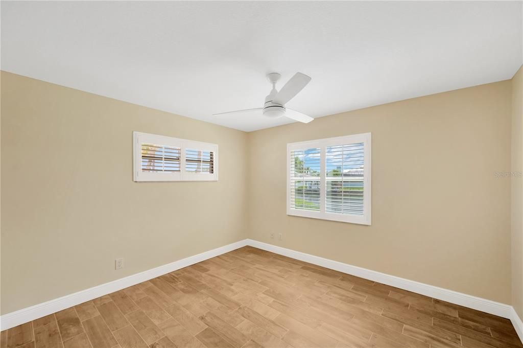 Bedroom # 2 is 11' x 12' with wood grained tile, ceiling fan and built-in closet.