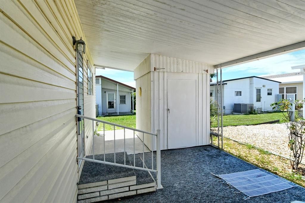 Covered Carport & Storage Shed