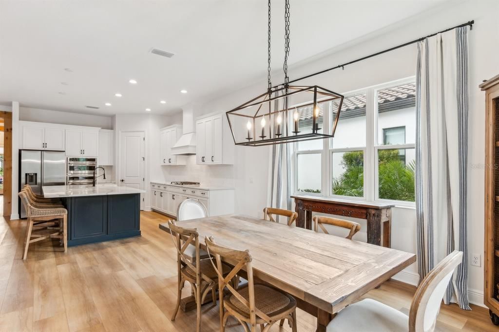 Dining Area with builder upgraded Western facing windows