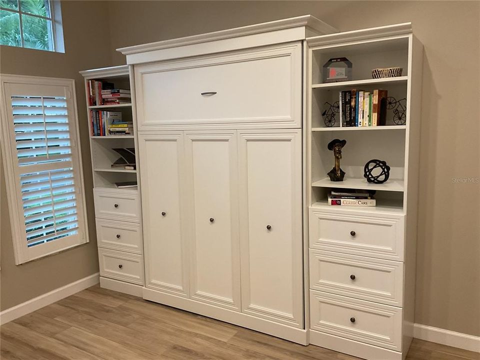 Queen size Murphy bed built-in with bookcases