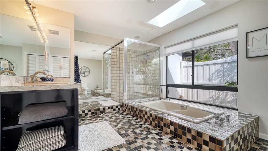 Separate tub and walk-in shower.