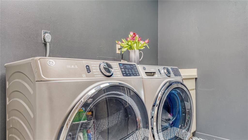 Laundry room with cabinet space.