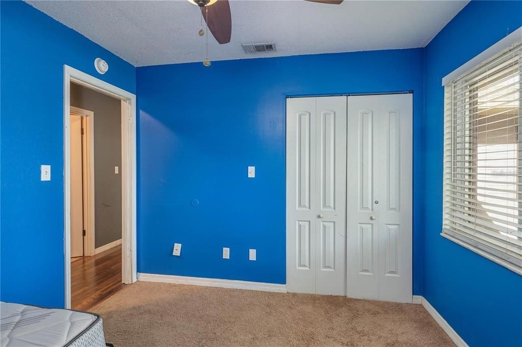 Third bedroom showing coat closet.