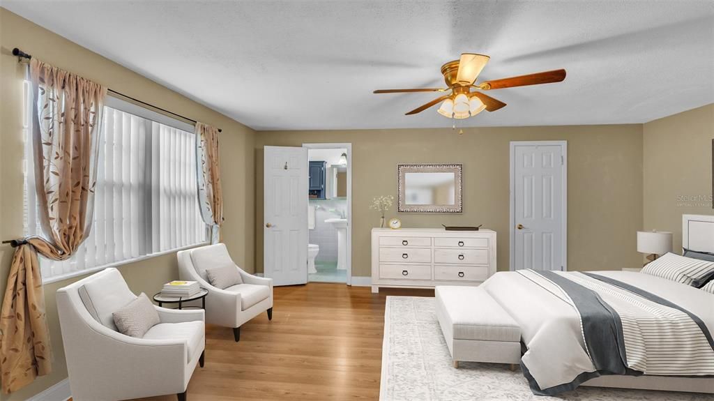 Primary Bedroom with En-Suite Bathroom and Walk-In Closet.  Virtually Staged.