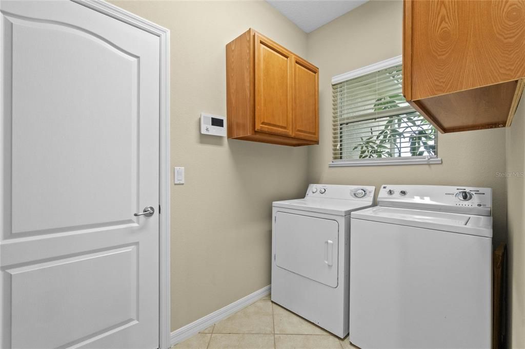 Kitchen overlooking Living room to Primary room. New ceiling fan