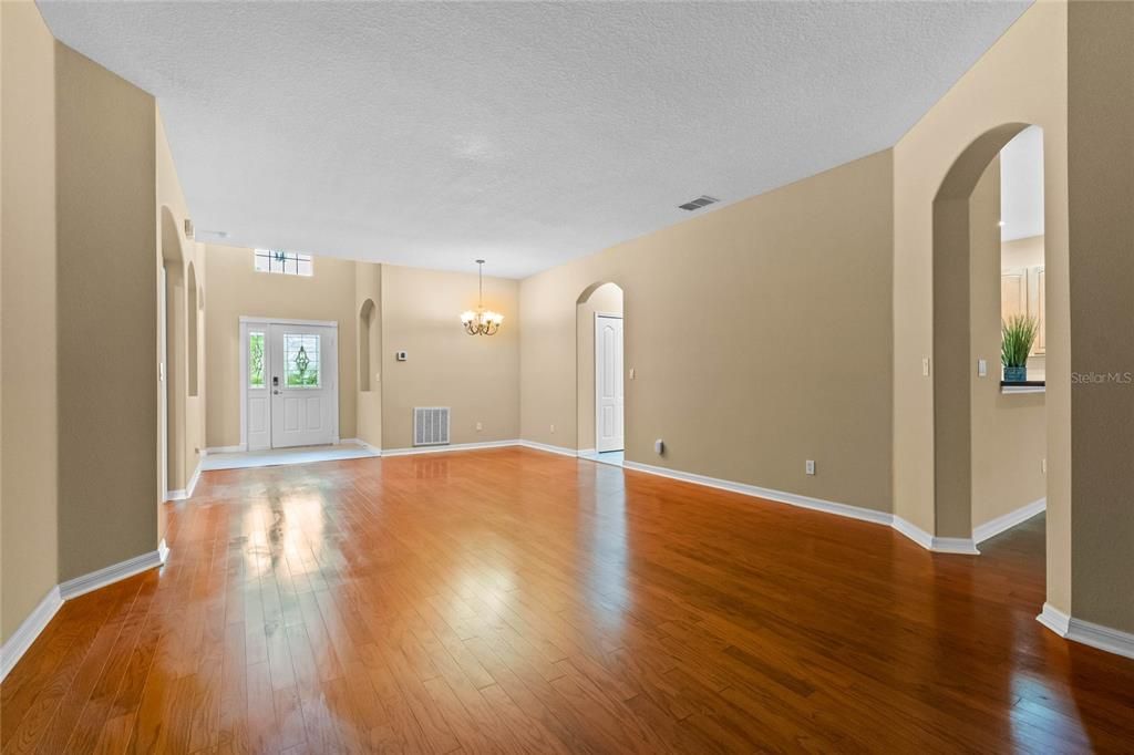 Open Concept Formal Dining & Family Room with engineered Hardwood floors