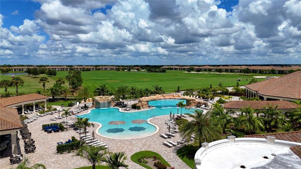 Pool overlooking golf course and tiki bar