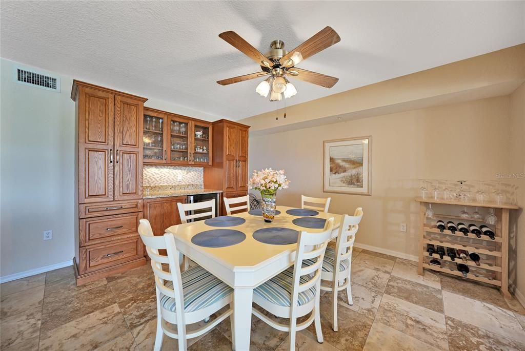 DINING AREA WITH BUILT IN CABINETRY AND WINE COOLER (bottom on cabinet)