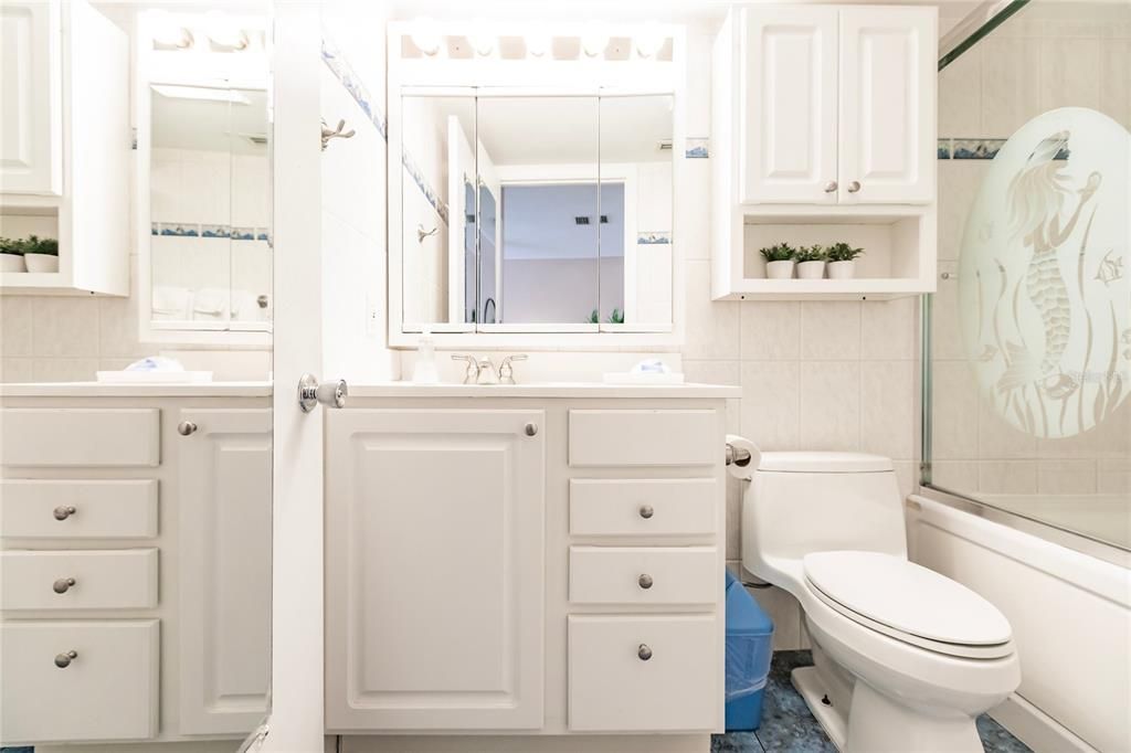 Full bathroom with shower and tub combo.