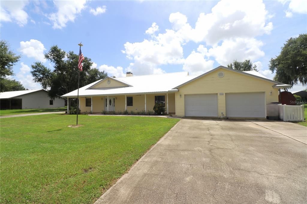 Oversized 2 car garage and parking pad