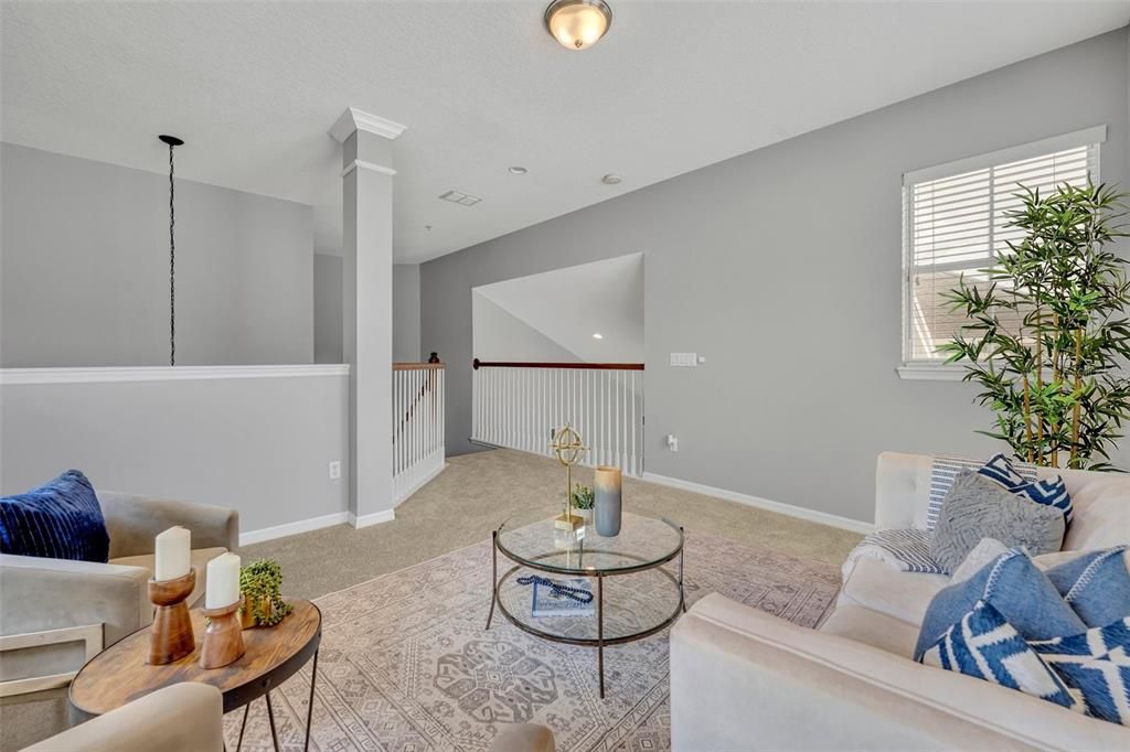 Virtually staged photo of loft area in main house.