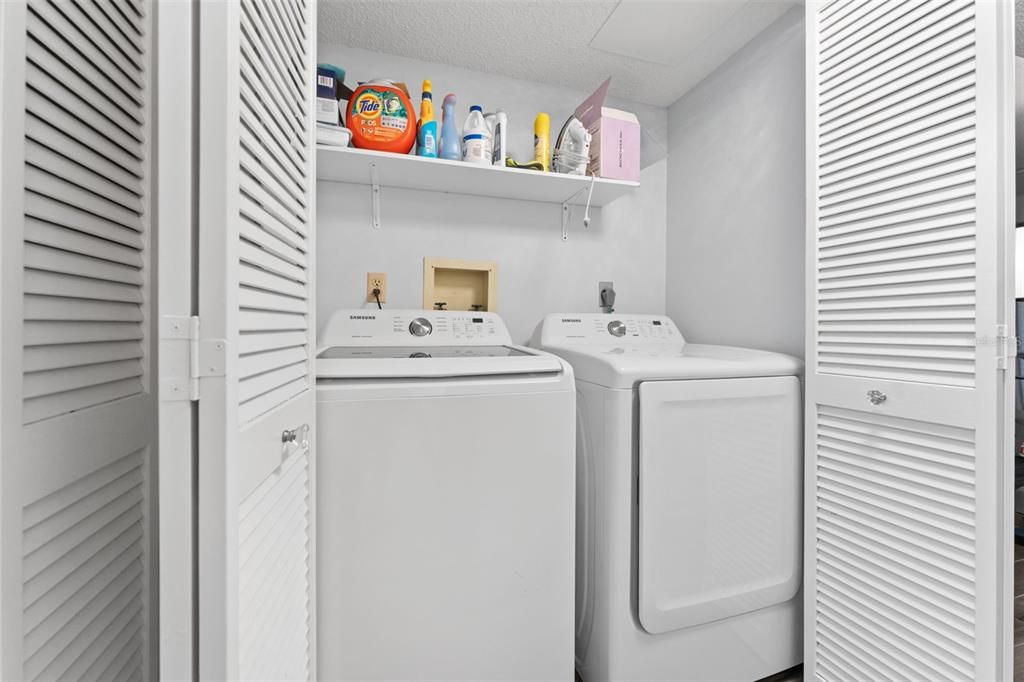 You have a full sized washer and dryer in the hallway.