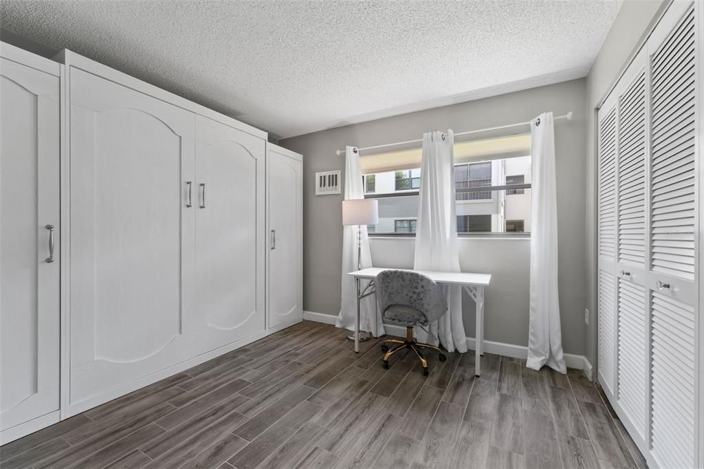 The guest bedroom has a brand new Murphy bed for you.  This is using the room as an office.