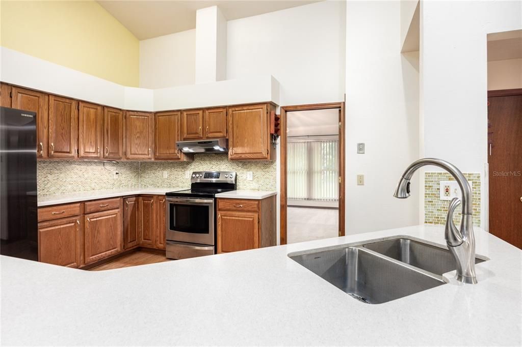 Tall ceilings, corian counter tops and double sink