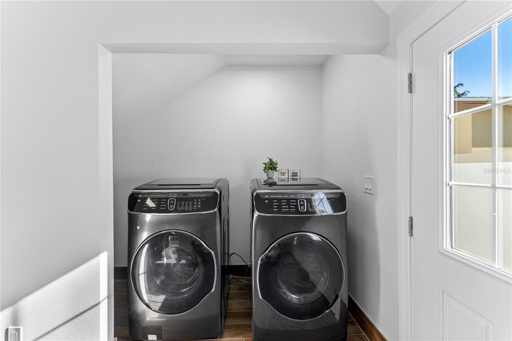 Laundry - NEW Samsung Flexwash Washer/Dryer. There is extra storage under the stairs to the left.