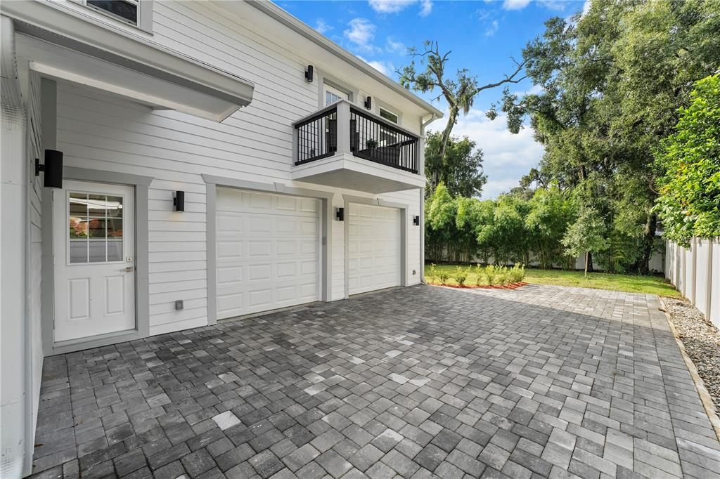 The 2-story addition with 2-car separate entry oversized garage. The Owner's suite balcony can be seen above.