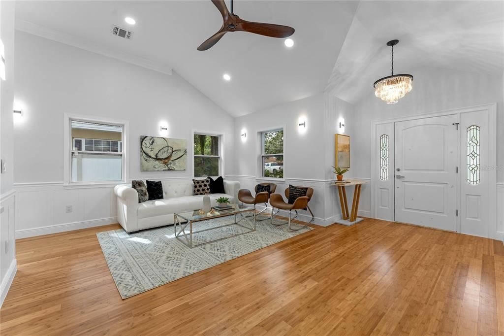 Living room with view of front entry foyer.