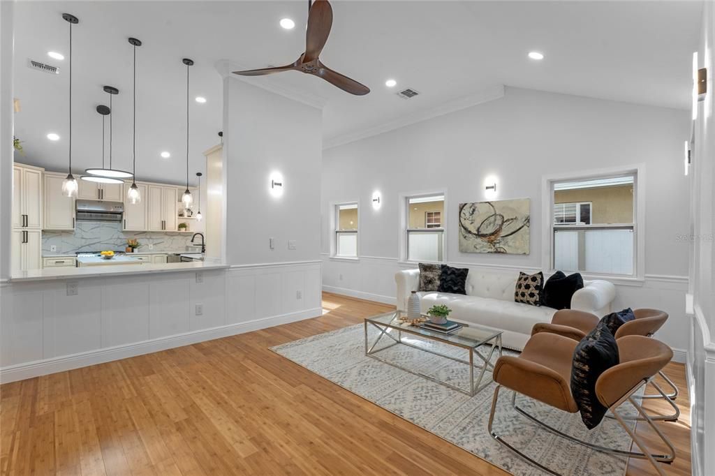 Living room overlooking kitchen through pass view.