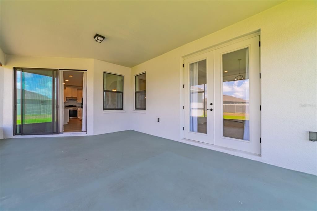 French door opens the lanai from the master bedroom