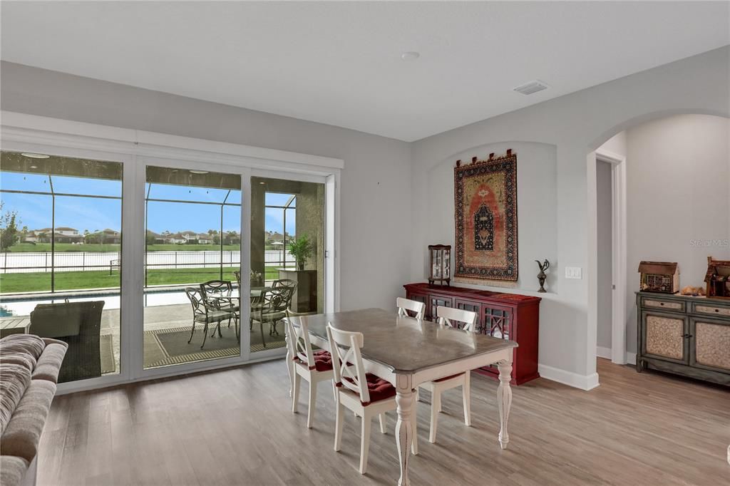 dinette, with a view of the pool and lake through the pocket sliding glass doors