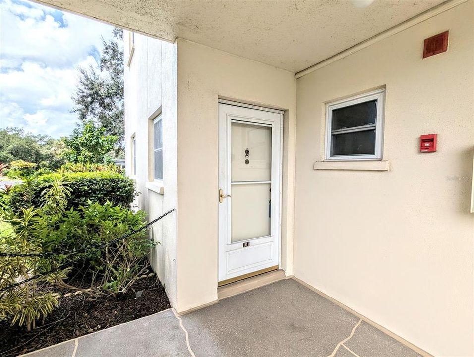 Entrance door to this ground floor end unit.